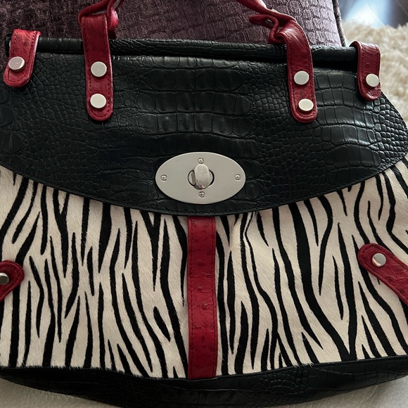 Animal hair zebra print bag with red and black leather trim. Silver buckle front - Picture 3 of 4